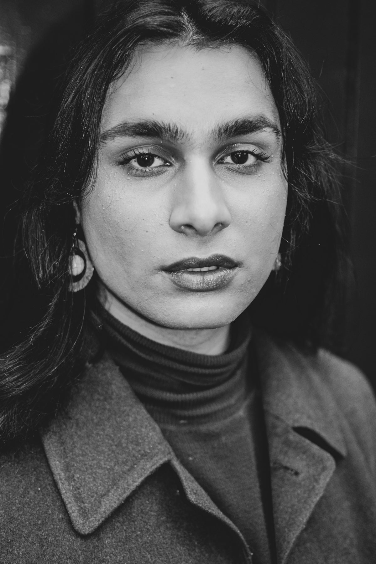 a black and white photo of a woman
