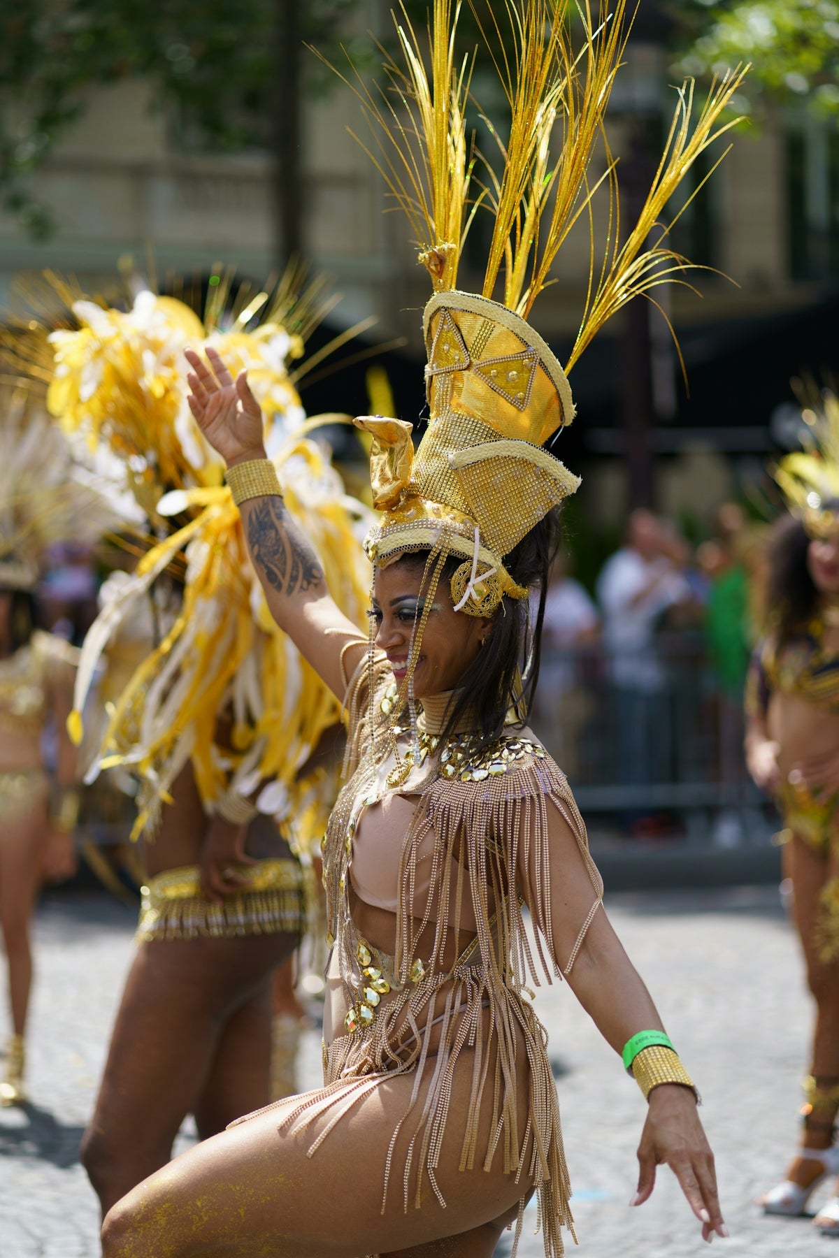 A group of women in costume dancing in the street