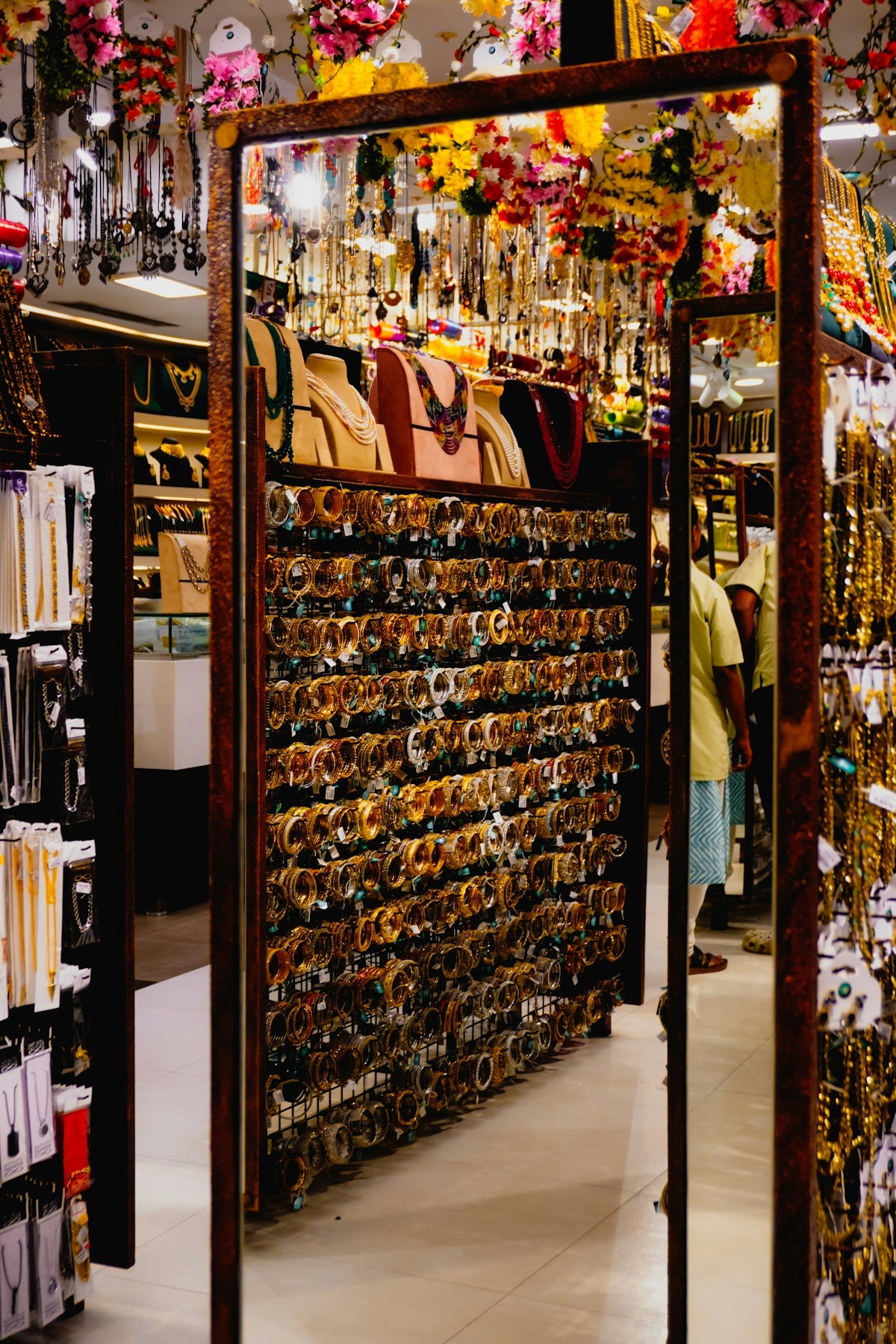 Store display of bangles and jewelry with other jewelry items